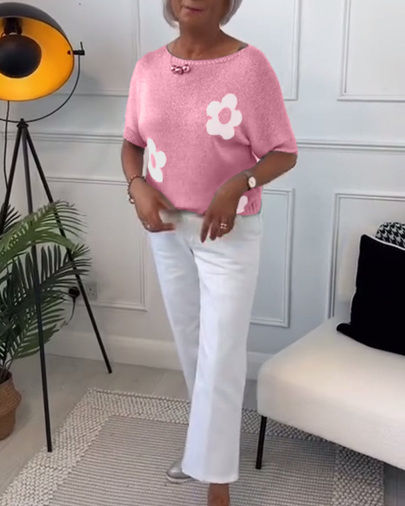 Slim fit sweater with round neck and floral patterns