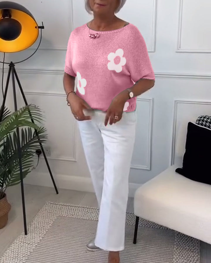 Slim fit sweater with round neck and floral patterns