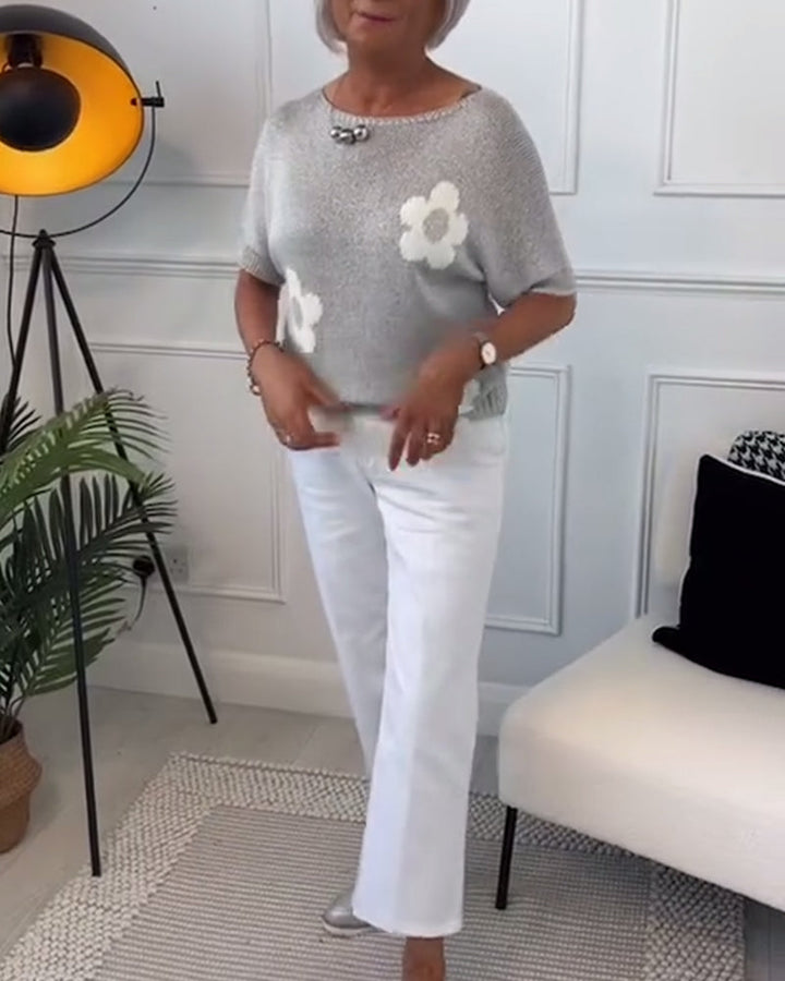 Slim fit sweater with round neck and floral patterns